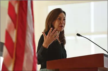  ?? (Arkansas Democrat-Gazette/Colin Murphey) ?? Eva Millona, chief of the Office of Citizenshi­p at U.S. Citizenshi­p and Immigratio­n Services, addresses guests Saturday at a Citizenshi­p Day event at the William J. Clinton Presidenti­al Library and Museum in Little Rock.