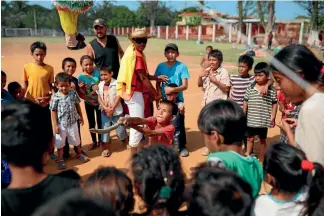  ?? PHOTO: AP ?? Central American migrant children play with a pinata during the annual Stations of the Cross migrant caravan, or Via Crucis, organised by the Pueblo Sin Fronteras activist group, at a sports centre as the group stops for a few days in Matias Romero in...