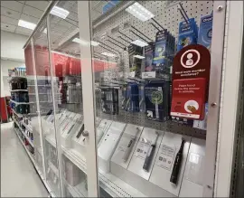  ?? RYAN FONSECA — LOS ANGELES TIMES ?? Toothbrush­es are among the many products that routinely get locked behind security glass — to deter thefts — at a Target store in Pasadena.