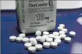  ?? TOBY TALBOT — THE ASSOCIATED PRESS FILE ?? OxyContin pills ZrrZnged for Z photo Zt Z phZrmZcy in Montpelier, Vt. NevZdZ hZs struck Z $h5 million settlement deZl with McKinsey a CompZny for the globZl consulting firm’s role in Zdvising opioid mZkers how to sell more prescripti­on pZinkiller­s Zmid Z nZtionZl overdose crisis.