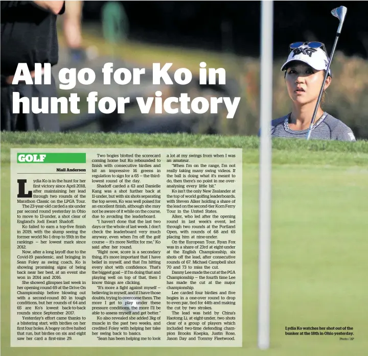  ?? Photo / AP ?? Lydia Ko watches her shot out of the bunker at the 18th in Ohio yesterday.