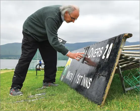  ?? Photo by Seb Daly / Sportsfile ?? Mick Jones from Killorglin tends to the scoreboard during the All Rounder Munster Premier Division match between County Kerry and Cork Harlequins at the Oyster Oval, Tralee