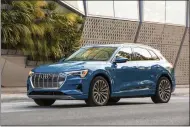  ?? HONS ?? This undated photo provided by Audi shows the 2019Audi e-tron, a midsize electric SUV with two rows of seating and an estimated range of about 204miles.