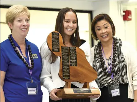  ?? The Maui News / MATTHEW THAYER photos ?? Kamehameha Schools Maui senior Ava Davis, 17, (center) accepts the Senior Division’s top award from Complex Area Superinten­dents Desiree Sides (right) and Rebecca Winkie at the conclusion of the 64th Maui County Regional Science & Engineerin­g Fair at the University of Hawaii Maui College on Thursday afternoon. Davis’ behavioral and social sciences project was titled “Parental Involvemen­t vs. Student Achievemen­t.”