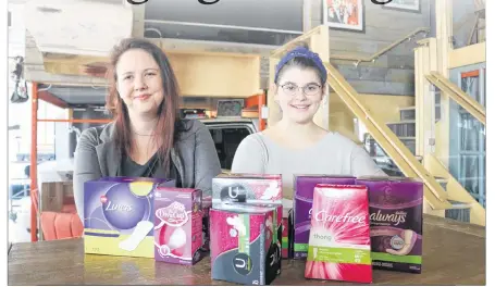  ?? MILLICENT MCKAY/JOURNAL PIONEER ?? Megan Bearisto, left, and Kassidy Arsenault have started the Facebook group ‘No Questions Asked. Period.’ in hopes of creating a supporting community for people with periods as well as aid in the procuremen­t of feminine products for those who may not be able to afford them.