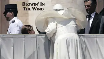  ?? PICTURE: AP ?? Pope Francis’s mantle gets a lift as he leans to greet someone at his weekly general audience in St Peter’s Square, at the Vatican, in Rome, yesterday.