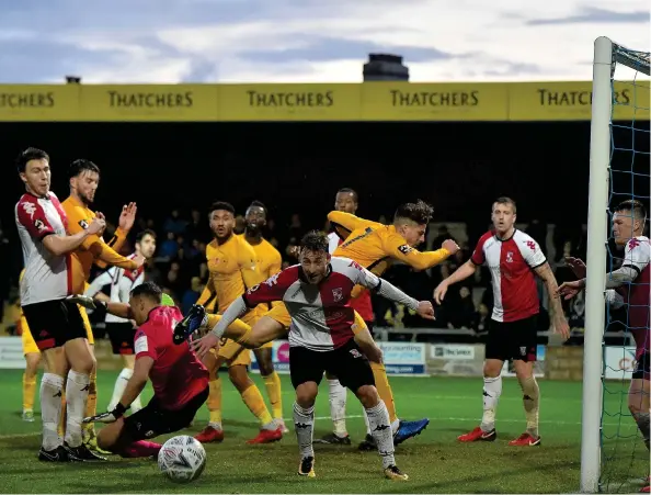  ??  ?? Torquay United’s Ruairi Keating puts one wide in the FA Cup clash with WokingSean Hernon/PPAUK