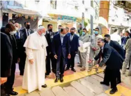  ?? AP ?? ■A white dove, symbol of peace, is released in front of Pope Francis as he arrives to a meeting with Iraq’s leading Shiite cleric, Grand Ayatollah Ali Al Sistani in Najaf, yesterday.