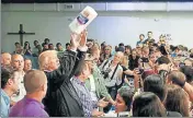  ?? REUTERS ?? Donald Trump tosses paper towels to people at a hurricane relief distributi­on centre in San Juan, Puerto Rico.