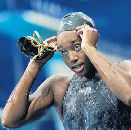  ?? DAVID GOLDMAN/AP ?? Simone Manuel leaves the pool after the 50-meter freestyle semifinal on Saturday in Tokyo.