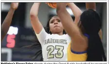  ?? (NWA Democrat-Gazette/Charlie Kaijo) ?? Nettleton’s Elauna Eaton shoots during the Great 8 girls basketball tournament Dec. 7 at Rogers Heritage in Rogers. The shot clock in the background, which has been used in some tournament­s the past two years, will be used in Class 6A games starting next season.