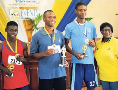  ?? ANTHONY MINOTT PHOTOS ?? Showayne Edwards (second left) won the men’s category of the Mayor George Lee Foundation 6Km road race in 20 minutes and 22 seconds to beat Bridgeport High’s 16-year-old athlete David Thomspon (left), who clocked 20 minutes and 42 seconds, while St...