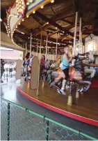  ??  ?? ABOVE. FUN FOR KIDS OF ALL AGES, THE FAIR’S MERRY-GO-ROUND IS A FAVORITE.