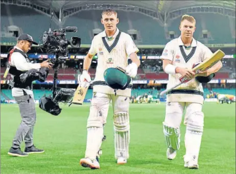  ?? AFP ?? Australia’s Marnus Labuschagn­e (L) and David Warner (R) were involved in an unbeaten 294-run stand on the first day of the second Test against Pakistan.