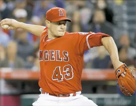  ??  ?? Los Angeles Angels pitcher Garrett Richards skipped Tommy John surgery in favor of rest, rehabilita­tion and stem-cell therapy.