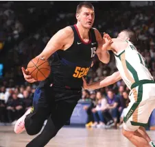  ?? — AFP photo ?? Jokic drives to the basket during the game against the Boston Celtics.