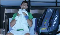  ?? MARK BAKER — THE ASSOCTED PRESS FILE ?? Defending champion Novak Djokovic had his visa revoked for a second time by Australian authoritie­s after he entered the country despite not being vaccinated against COVID-19.