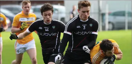  ??  ?? Johnny Kelly and Kevin McDonnell fight for possession for Sligo during Sunday’s encounter with Antrim. Pics: Eamonn McMunn.