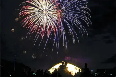  ?? ASSOCIATED PRESS PHOTOS ?? Fireworks fill the sky near the conclusion of the Vermont Symphony Orchestra show at Grafton Pond, in Grafton, Vt.