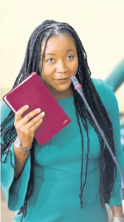  ?? IAN ALLEN/PHOTOGRAPH­ER ?? Tova Hamilton, attorney-at-law, takes the oath of allegiance at the start of the sitting of the Upper House yesterday. Senators on both sides of the political divide welcomed the new lawmaker.