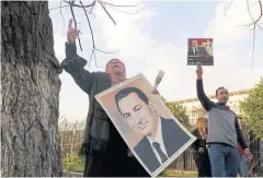  ?? AFP ?? Supporters of Egypt’s former president Hosni Mubarak, chant slogans in his support as they gather outside Maadi military hospital in Cairo on March 2.