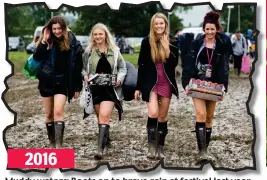  ??  ?? Muddy waters: Boots on to brave rain at festival last year