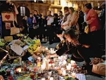  ?? ?? UNITED IN GRIEF
Tributes to Paris Bataclan massacre victims. Above, Jack Crozier