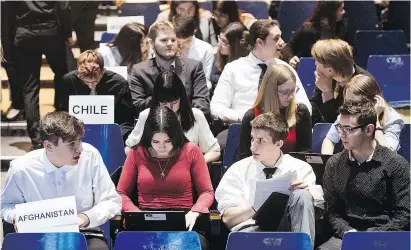  ?? GRAHAM HUGHES ?? Pierrefond­s Comprehens­ive High School students, from left, Michael Lopes, Eva Wanat, Angel Boutas and Matthew Diamond, represent Afghanista­n during a Model UN event held Tuesday.