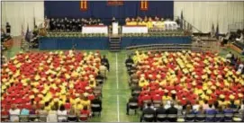  ?? DIGITAL FIRST MEDIA FILE PHOTO ?? At Haverford High School graduation­s, young men have traditiona­lly wore red gowns while women wore yellow. That may change.