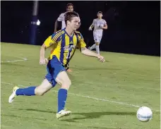  ?? Photo courtesy of JBU Sports Informatio­n ?? John Brown junior Conner Haney runs down a ball Thursday during the Golden Eagles’ match against Wayland Baptist (Texas).