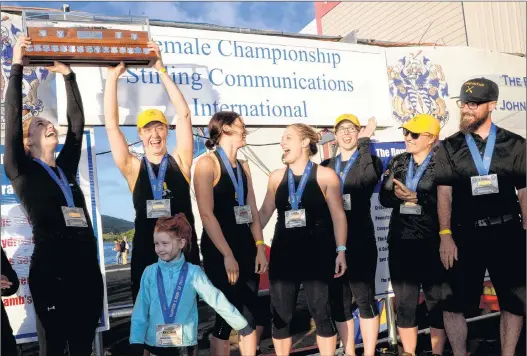  ?? KEITH GOSSE ?? Members of the M5 crew hoist their trophy after winning the women’s championsh­ip race for the second straight year at the Royal St. John’s Regatta Wednesday. The crew are (from left) Alyssa Devereaux, Nancy Beaton, Kate Wadden, Amanda Ryan, Jane...