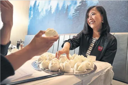  ?? RICHARD LAUTENS/TORONTO STAR ?? Star food writer Karon Liu chats with Pixar artist Domee Shi at Spadina’s Rol San restaurant talking about her new animated short, “Bao.” The eight-minute film screens before “Incredible­s 2.”