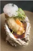  ??  ?? Tempura Oyster is paired with a single shiso leaf and chili oil.