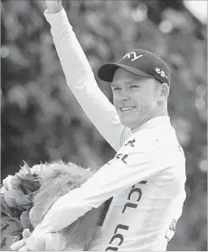  ?? Laurent Rebours Associated Press ?? CHRIS FROOME, shown basking in victory on Sunday, needs only one more title to match the Tour de France record of five.