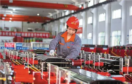  ?? ?? Bullish sentiment: A worker manning a production line at a factory that manufactur­es transforme­rs in Haian. A recent UBS Group AG survey of chief financial officers in China showed that firms are thinking about increasing manufactur­ing capital expenditur­e. — AFP