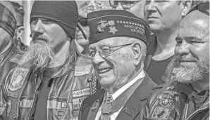  ?? GREG EANS/THE MESSENGER-INQUIRER VIA AP, FILE ?? Herschel “Woody” Williams, center, is remembered for astounding heroism in the 1945 Battle of Iwo Jima.