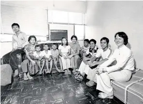  ?? Chronicle file photo ?? Phyllis Nguyen, right, visits with 10 recent Vietnamese refugees who had arrived in Houston in 1979. Nguyen headed the Interfaith Refugee Resettleme­nt Committee, which looked for churches to sponsor refugee families moving to the area. Both Houston and Texas have a long history of welcoming refugees, who in many cases have left their home countries to escape persecutio­n, war or violence.