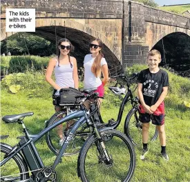  ??  ?? The kids with their e-bikes