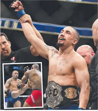  ?? PROUDROUD MOMENT MOMENT: A Australian fighter Robert Whittaker is announced as the UFC interim middleweig­ht champion in Las Vegas Nevada ( main) and Whittaker kicks Yoel Romero ( inset). ??