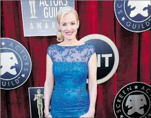 ?? Kevork Djansezian, Getty Images ?? Actress Penelope Ann Miller wore a blue David Meister, featuring all-over
embroidery, on the red carpet at the Screen Actors Guild Awards.