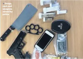  ??  ?? > Drugs, cash and weapons seized by police