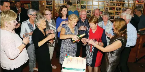  ??  ?? Listowel Tidy Towns group celebrates a magnificen­t result in this year’s Tidy Towns competitio­n in Mike The Pies Bar.