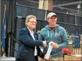  ?? COURTESY OF PA FARM SHOW ?? For the Pennsylvan­ia Farm Show Cider Competitio­n, Cheryl Cook, Deputy Secretary of Agricultur­e, presents Steve Frecon of Frecon Farms with one of two ribbons.