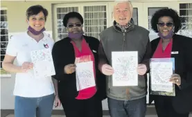  ??  ?? Vicky Venter, Cindy Nsibande, David McCarthy and Millie Mlilo with some of McCarthy’s artworks.