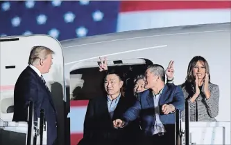  ?? SUSAN WALSH THE ASSOCIATED PRESS ?? U.S. President Donald Trump greets Tony Kim, Kim Hak Song and Kim Dong Chul, three Americans detained in North Korea for more than a year, at Andrews Air Force Base in Maryland. At right is first lady Melania Trump.