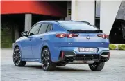  ?? ?? Left: The X2 is available in 115kW and 233kW versions. Above: The X2 M35i xDrive has a unique rear apron with a four-pipe exhaust system and an M specific spoiler. Above right: Both models have BMW’s Curved Display and intelligen­t personal assistant.