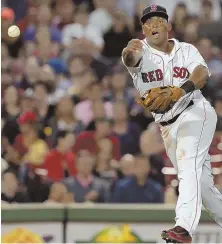  ?? STaff phoTo by JohN WILCoX ?? HOT START AT HOT CORNER: Rafael Devers, who also started a 5-4-3 triple play, fires to first for an out during the Red Sox’ 10-4 victory against the Cardinals.