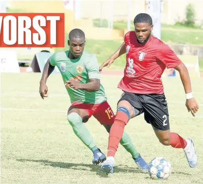  ??  ?? Oneil Anderson (right) of Arnett Gardens getting the better of Humble Lion’s Lorenzo Lewin during a Jamaica Premier League match played on Monday at the Stadium East field. Arnett Gardens won 2-1.