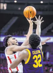  ?? L.E. Baskow Las Vegas Review-journal ?? UNLV’S Bryce Hamilton goes up for a shot over California’s Jalen Celestine at the Thomas & Mack Center on Saturday.