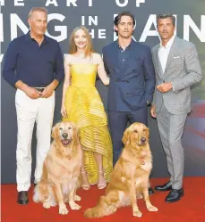  ?? RODIN ECKENROTH/GETTY ?? Kevin Costner, from left, Amanda Seyfried, Milo Ventimigli­a and Patrick Dempsey, along with dog co-stars Parker and Butler, attend the premiere of “The Art of Racing in the Rain” at the El Capitan Theatre in Los Angeles. Seyfried said she she grew up adoring Costner and met him for the first time at the premiere.